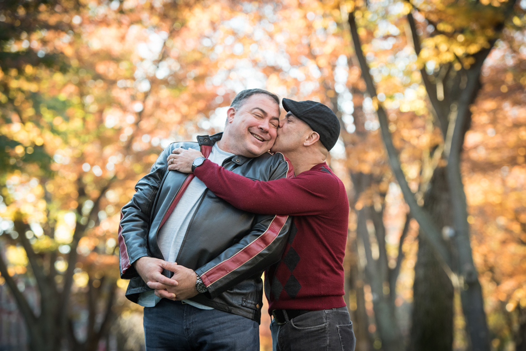 cute gay couple kissing fall engagement session boston