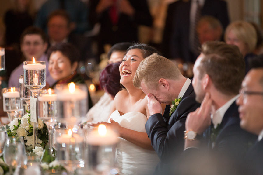 bride and groom react to great wedding toast