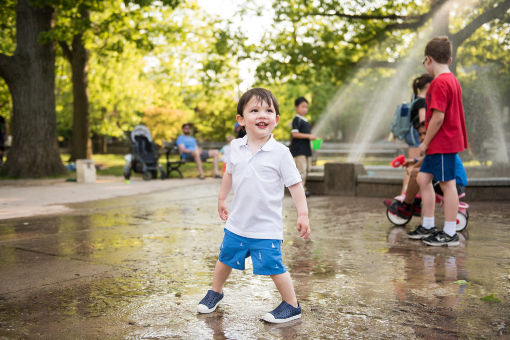 Fun family portraits brookline kid playing outside