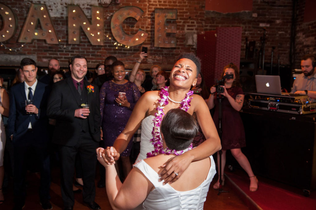 two brides laugh while dancing bella luna jamaica plain wedding