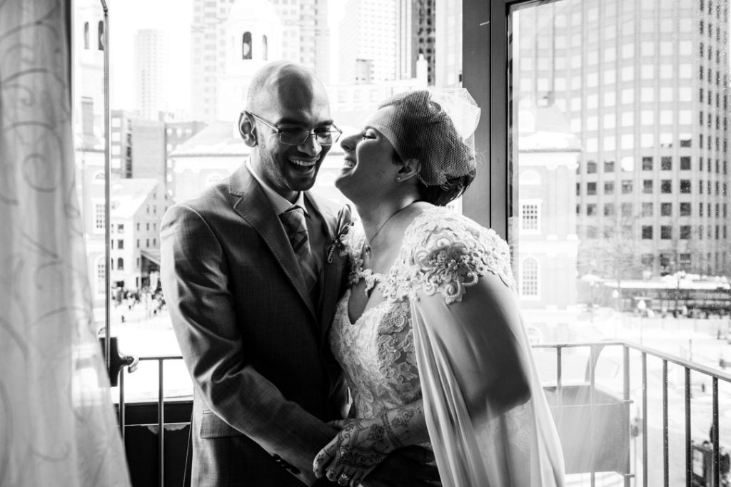 bostonian hotel wedding couple on balcony laughing