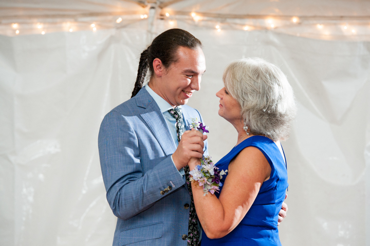 mother and son dancing at a wedding