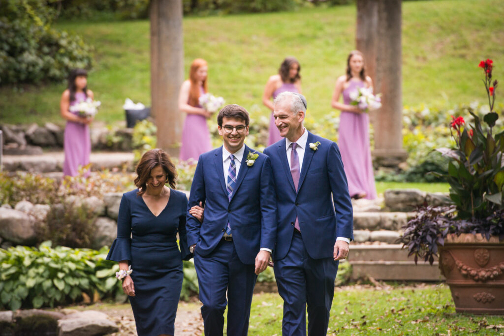 codman estate wedding photo walking down the aisle with parents