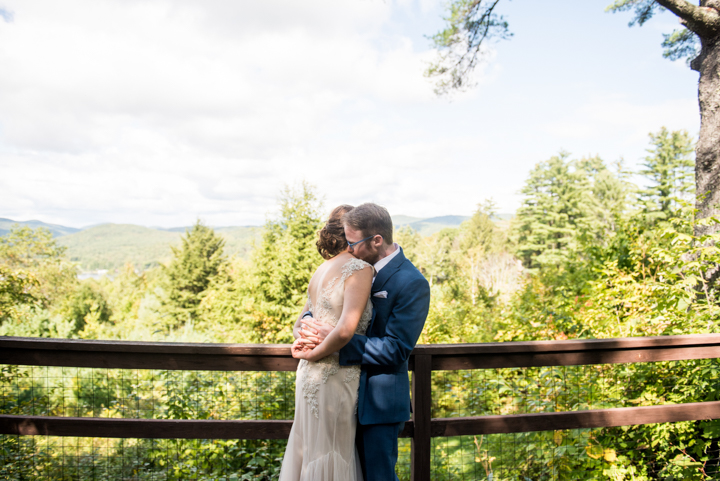 couple pose for a photo outside before a fall wedding in Vermont