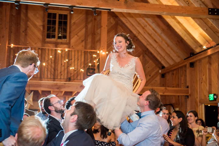 bride lifted in a chair for the Hora wedding dance